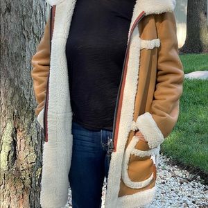 Reversible coach leather and shearling coat